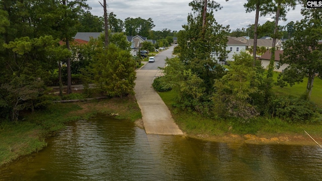 exterior space with a residential view and a water view