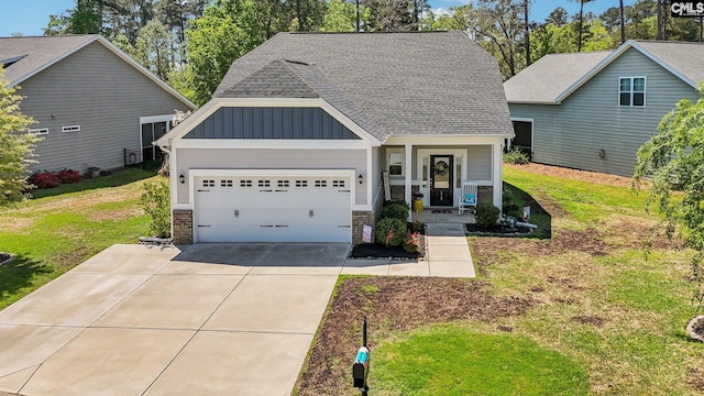 craftsman-style house featuring board and batten siding, driveway, stone siding, and a garage