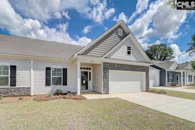 view of front of property featuring concrete driveway, a front yard, stone siding, and an attached garage