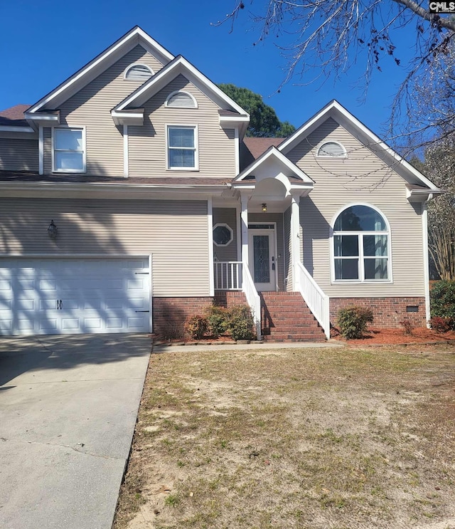 view of front of home featuring a garage, driveway, a front lawn, and brick siding