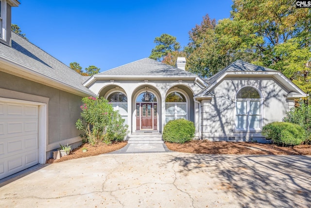 1168 Peninsula Dr, Prosperity, SC 29127 - doorway to property featuring crawl space, a shingled roof, a chimney, and stucco siding