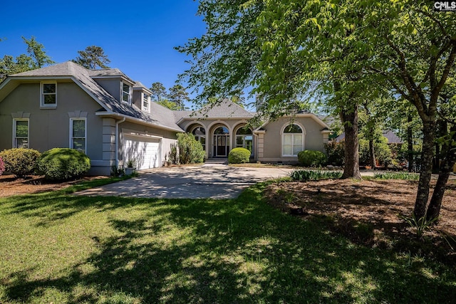 1168 Peninsula Dr, Prosperity, SC 29127 - view of front of home featuring a garage, a front lawn, and concrete driveway