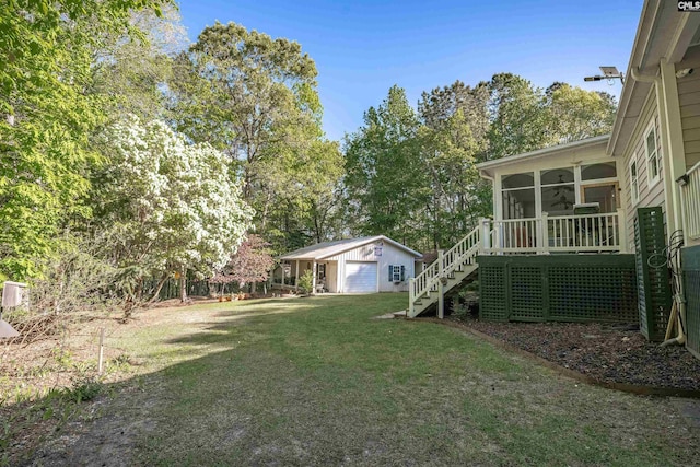 107 Turkey Ridge Ln, Lugoff, SC 29078 - view of yard with stairway, an outdoor structure, a sunroom, and a garage