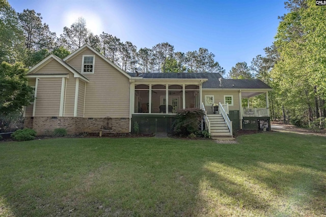 107 Turkey Ridge Ln, Lugoff, SC 29078 - back of property with a lawn, a sunroom, crawl space, and stairway