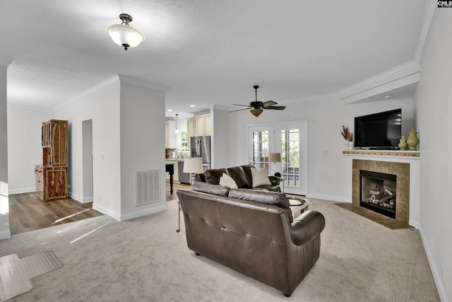 107 Turkey Ridge Ln, Lugoff, SC 29078 - living room featuring a ceiling fan, visible vents, ornamental molding, and light colored carpet