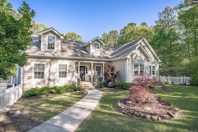 107 Turkey Ridge Ln, Lugoff, SC 29078 - cape cod home featuring fence, covered porch, and a front yard