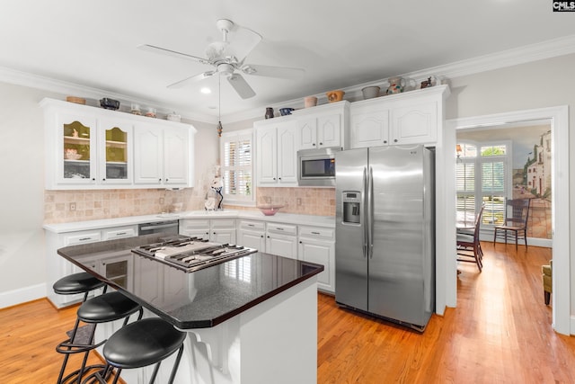 411 Turkey Point Cir, Columbia, SC 29223 - kitchen featuring plenty of natural light, white cabinetry, ornamental molding, and stainless steel appliances