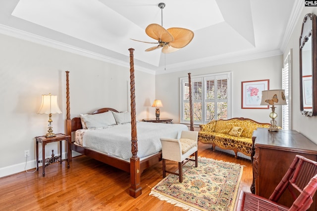 411 Turkey Point Cir, Columbia, SC 29223 - bedroom with a tray ceiling, baseboards, light wood-style floors, a ceiling fan, and crown molding