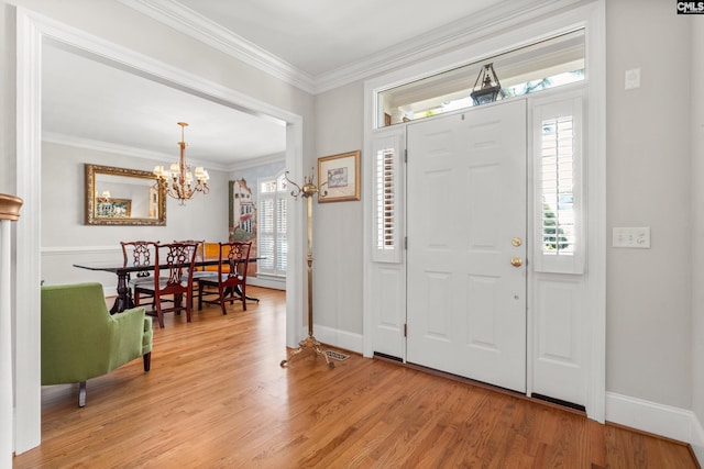 411 Turkey Point Cir, Columbia, SC 29223 - entrance foyer with light wood-type flooring, baseboards, a notable chandelier, and crown molding
