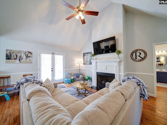 78 Southern Oak Dr, Camden, SC 29020 - living area with wood finished floors, french doors, a fireplace, high vaulted ceiling, and ceiling fan