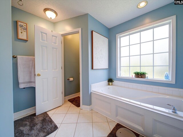 78 Southern Oak Dr, Camden, SC 29020 - full bath with a bath, a textured ceiling, tile patterned floors, and baseboards