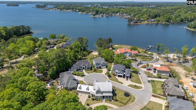 birds eye view of property with a water view and a residential view
