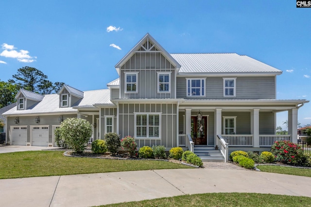 craftsman house featuring a garage, a porch, metal roof, and board and batten siding
