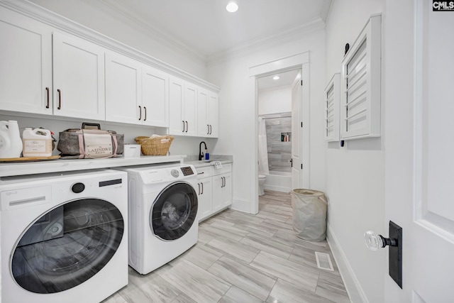clothes washing area featuring recessed lighting, washer and clothes dryer, visible vents, ornamental molding, and cabinet space