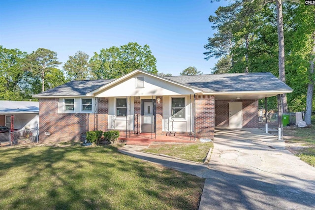 1015 Mandel Dr, Columbia, SC 29210 - view of front of home with concrete driveway, covered porch, fence, a front yard, and brick siding
