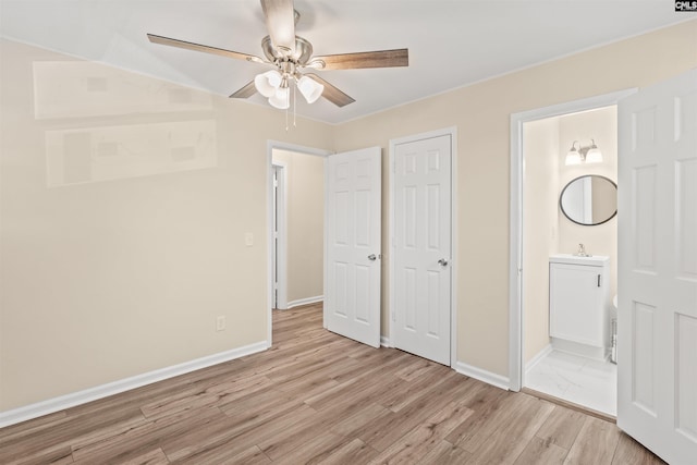 1015 Mandel Dr, Columbia, SC 29210 - unfurnished bedroom featuring connected bathroom, a sink, light wood-style floors, baseboards, and ceiling fan