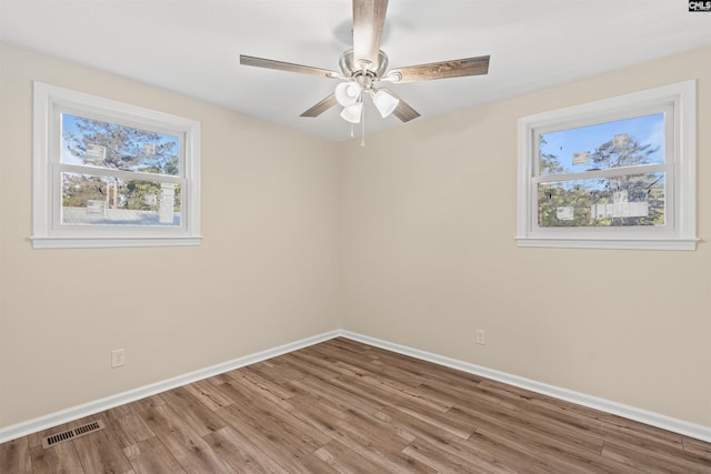 1015 Mandel Dr, Columbia, SC 29210 - empty room with wood finished floors, visible vents, baseboards, and ceiling fan