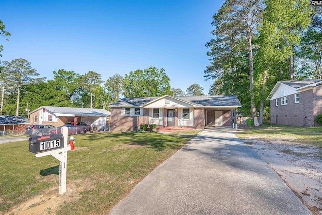 1015 Mandel Dr, Columbia, SC 29210 - ranch-style home featuring aphalt driveway, covered porch, a carport, brick siding, and a front yard