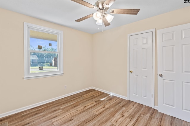 1015 Mandel Dr, Columbia, SC 29210 - unfurnished bedroom with light wood-style flooring, baseboards, and a ceiling fan