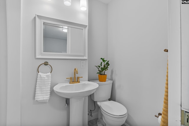 bathroom featuring a sink and toilet