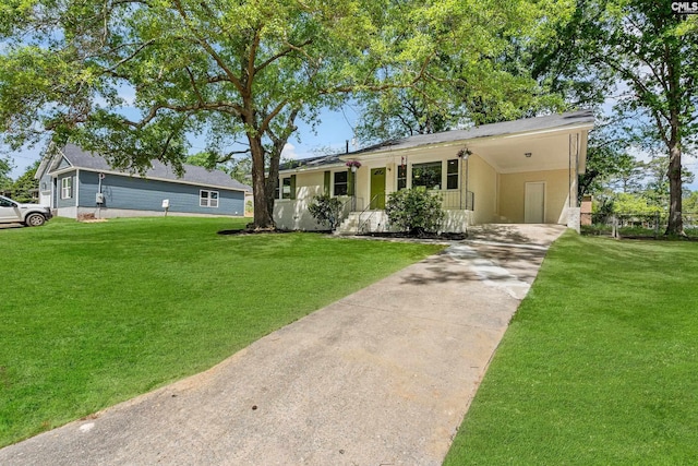 ranch-style house featuring a carport, driveway, and a front yard
