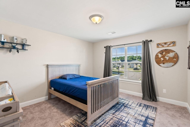 bedroom with visible vents, baseboards, and carpet flooring