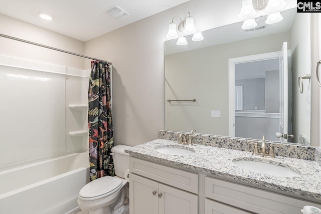 bathroom featuring visible vents, a sink, and toilet