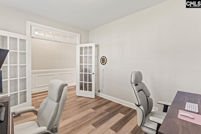 office with baseboards, french doors, and wood finished floors