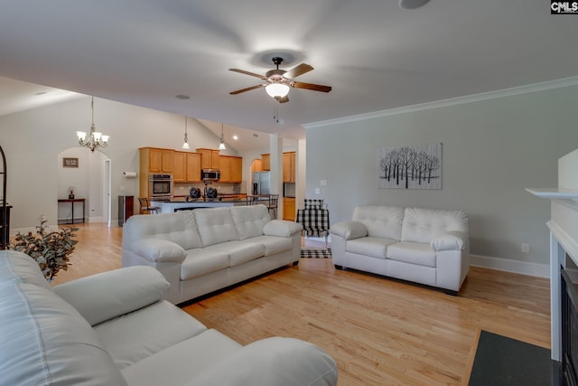 living area featuring lofted ceiling, light wood-type flooring, and ceiling fan with notable chandelier