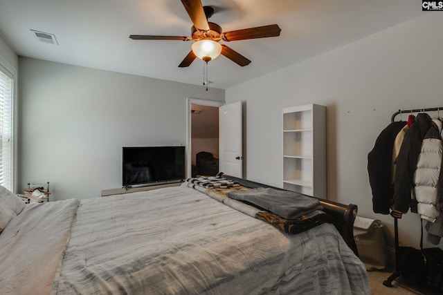bedroom featuring a ceiling fan and visible vents