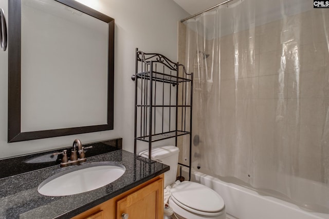 bathroom featuring shower / bath combo, toilet, and vanity