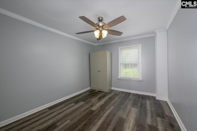 unfurnished room with baseboards, ornamental molding, ceiling fan, and dark wood-style flooring