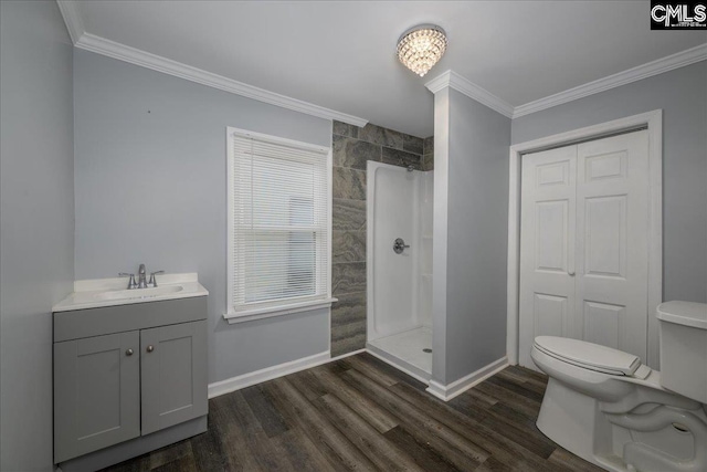 full bathroom featuring walk in shower, crown molding, toilet, and wood finished floors