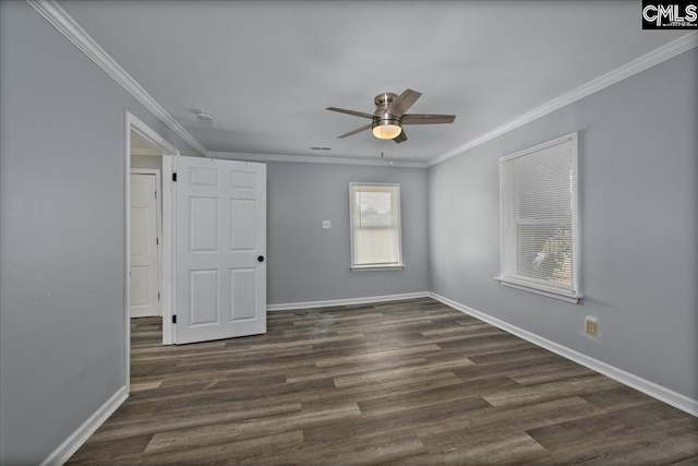 spare room featuring dark wood-style floors, baseboards, ceiling fan, and crown molding