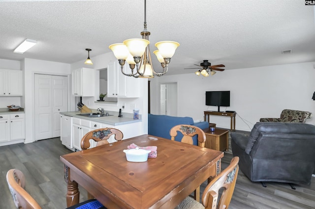 520 Blue Lake Dr, Lexington, SC 29072 - dining room featuring dark wood finished floors, ceiling fan with notable chandelier, a textured ceiling, and visible vents