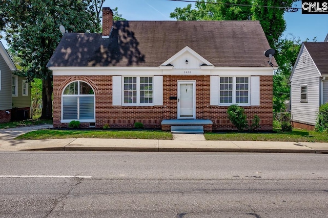 3428 Rosewood Dr, Columbia, SC 29205 - view of front of home with a chimney, brick siding, and a shingled roof