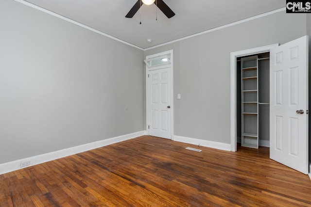 3428 Rosewood Dr, Columbia, SC 29205 - unfurnished bedroom featuring wood finished floors, a ceiling fan, a closet, crown molding, and baseboards