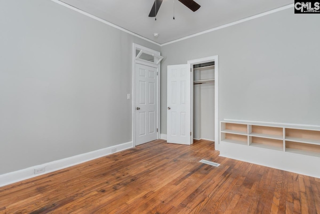 3428 Rosewood Dr, Columbia, SC 29205 - unfurnished bedroom featuring wood finished floors, a closet, ceiling fan, and ornamental molding