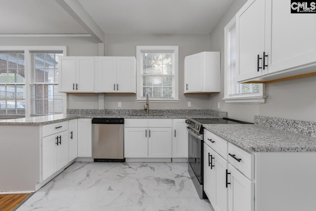 3428 Rosewood Dr, Columbia, SC 29205 - kitchen featuring white cabinets, a peninsula, a sink, light stone counters, and appliances with stainless steel finishes