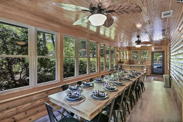 sunroom with wooden ceiling, visible vents, and wood-type flooring