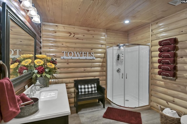 bathroom featuring wood finished floors, a stall shower, vanity, wooden ceiling, and log walls