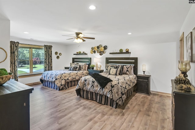 bedroom with baseboards, a ceiling fan, wood finished floors, and recessed lighting