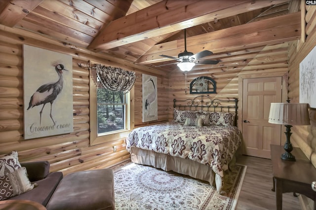 bedroom with wooden ceiling, rustic walls, wood finished floors, and vaulted ceiling with beams
