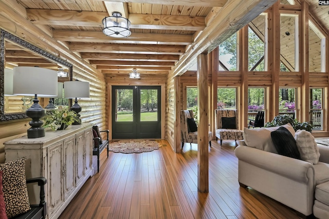 interior space featuring wood ceiling, french doors, wood-type flooring, log walls, and beam ceiling