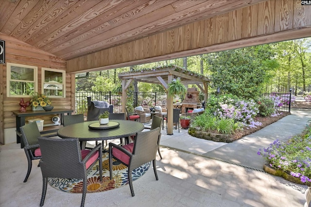 view of patio / terrace featuring fence and outdoor dining area