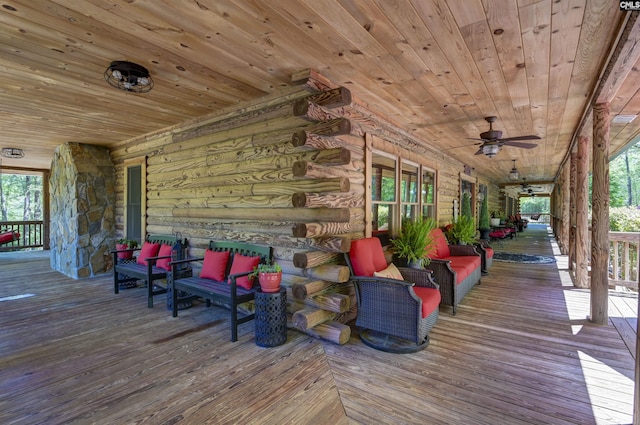 deck featuring outdoor lounge area, a porch, and a ceiling fan