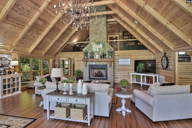 living area with wood ceiling, beam ceiling, an inviting chandelier, and high vaulted ceiling