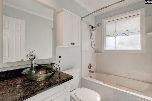full bath featuring toilet, vanity, ornamental molding, and  shower combination