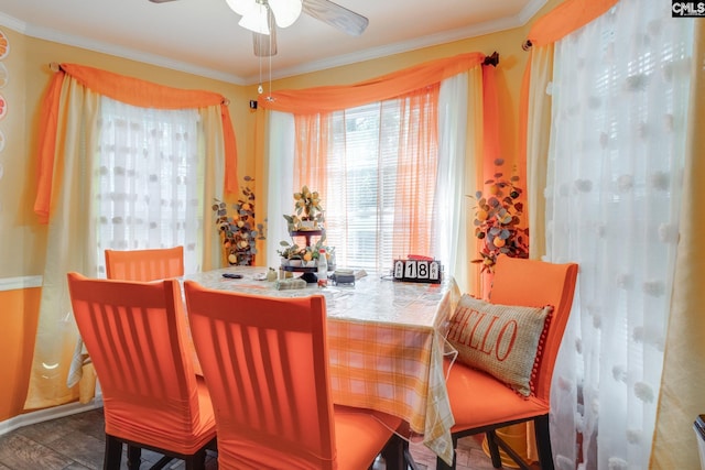 dining room featuring crown molding and a ceiling fan