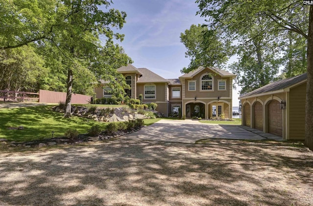 1305 Rock Island Rd, Gilbert, SC 29054 - mediterranean / spanish home with fence, driveway, stucco siding, and a garage